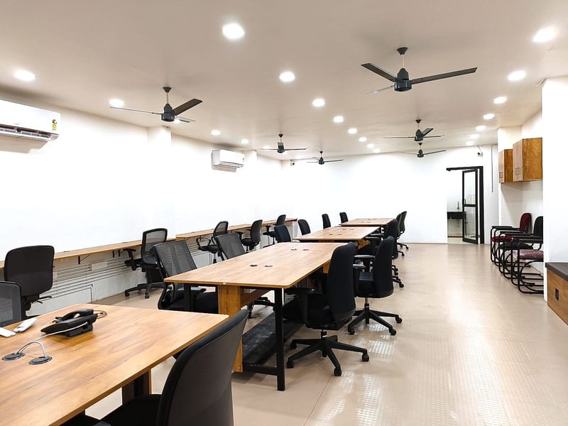 Wooden co-working desks with phones
